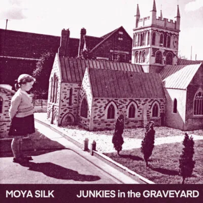 Vintage-style image of young girl staring at miniature church model, with “Moya Silk Junkies in the Graveyard” text below.